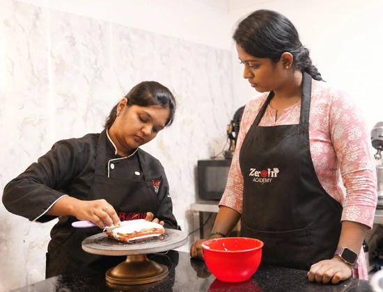 Student baking cake in Zeroin Academy class