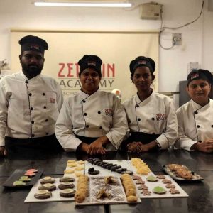 Group of students showcasing their baked goods