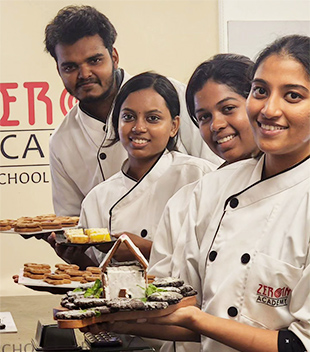 Students showcasing a cake